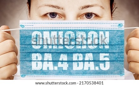 Face masks with inscriptions  Omicron BA.4 BA.5 . Covid 19 alpha, beta, gamma, delta, lambda, mu, omicron variants outbreak around the world. Royalty-Free Stock Photo #2170538401