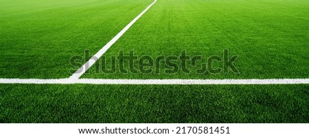 Football field of artificial grass. White line on the soccer green field.