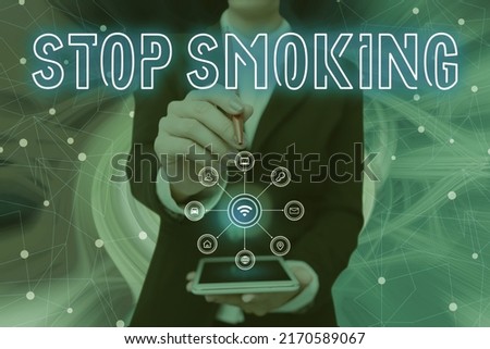 Hand writing sign Stop Smoking. Business concept Discontinuing or stopping the use of tobacco addiction Lady Pressing Screen Of Mobile Phone Showing The Futuristic Technology