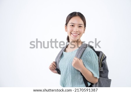 Young Asian student girl backpack on isolated background