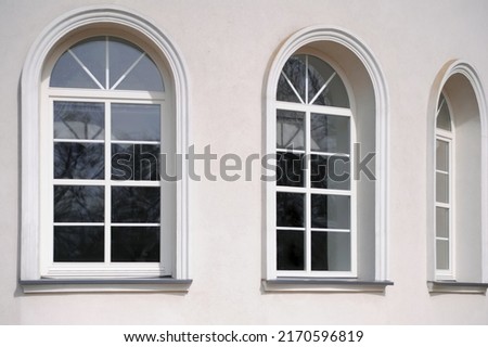 Beautiful arched windows in building, view from outdoors Royalty-Free Stock Photo #2170596819