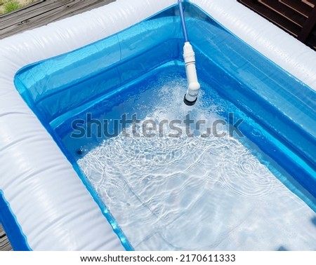 portable swimming pool  reflected on the surface