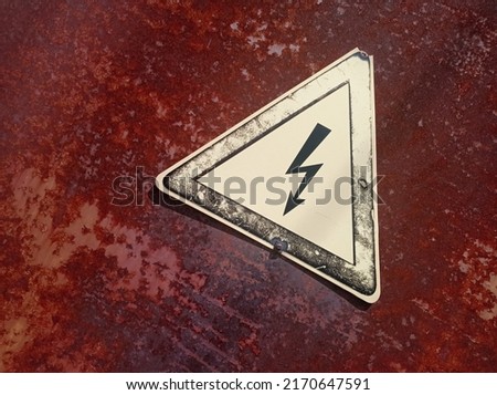 Old sign, danger of electric shock. danger symbol Royalty-Free Stock Photo #2170647591