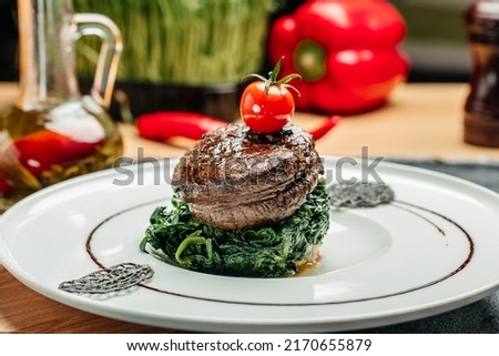 Medallions steaks from the beef tenderloin with spinach, Delicious balanced food concept,