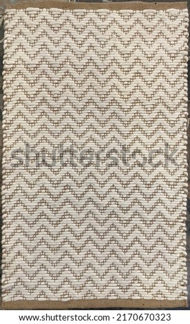Flat weave woven natural area rug. Royalty-Free Stock Photo #2170670323