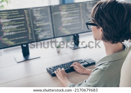 Back view photo of cool intelligent student girl system administrator practicing improving system optimize security