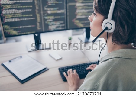 Profile side view portrait of attractive confident girl coding writing text solving task qa consulting client at work place station indoors Royalty-Free Stock Photo #2170679701