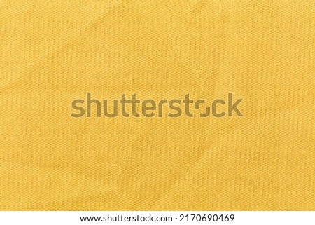 The High Resolution Yellow Textile stock textured as background.