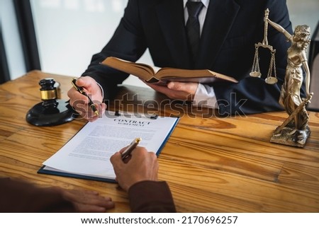 Attorneys or lawyers who are reading the statute of limitations Consultation between male lawyers and business clients, tax and legal and legal services firms.