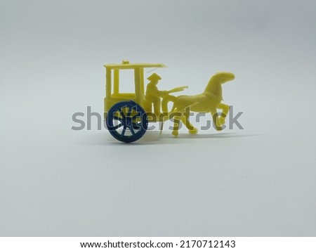 children's toys, ancient means of transportation pulled by a horse commonly called a wagon
