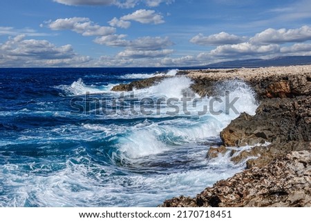Big waves break on the rocky shore on the mediterranean sea.Cyprus Royalty-Free Stock Photo #2170718451