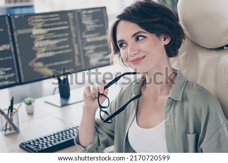 Portrait of attractive experienced smart clever cheery minded girl technician solving task thinking at work place space indoors