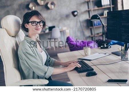 Profile photo of happy clever hardware expert sitting chair keyboard typing write code workplace indoors