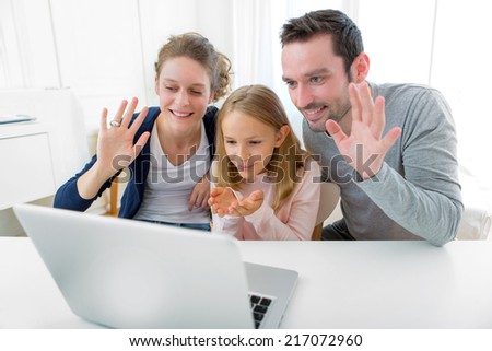 View of a Family having a videocall on a laptop Royalty-Free Stock Photo #217072960