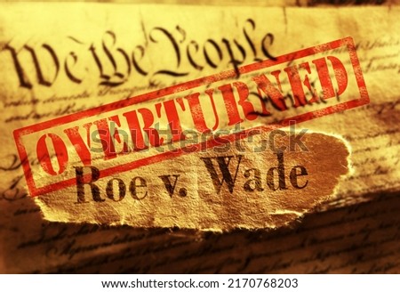 Roe V Wade newspaper headline with red Overturned stamp on the United States Constitution                                Royalty-Free Stock Photo #2170768203