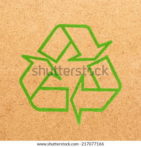 Recycle symbol on wood board