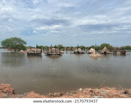 Flood affected deserted houses South Sudan Royalty-Free Stock Photo #2170793437
