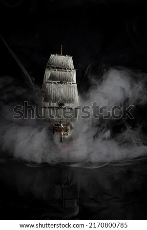 dark photos of the assembled model of a pirate ship Royalty-Free Stock Photo #2170800785