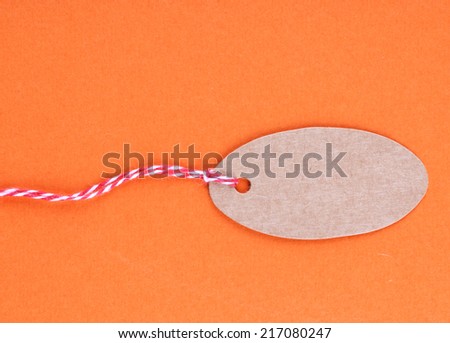 Brown tag on colorful background