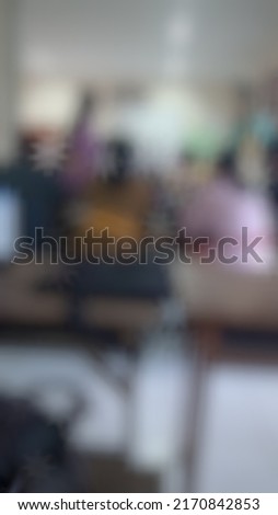 Defocused or blurred abstract background of students in a big class