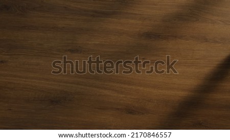 Natural Hartwood Table Top background with dark oak brown ornate marbled wood pattern. Full Frame luxury grain wood board carpentry decor backdrop banner template with copy space for product showcase. Royalty-Free Stock Photo #2170846557