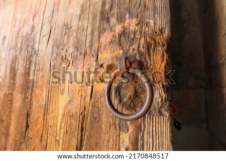 The ancient wooden tomb door is in the eastern Tomb of the Qing Dynasty, China