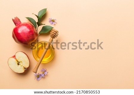 Flat lay composition with symbols jewish Rosh Hashanah holiday attributes on colored background, Rosh hashanah concept. New Year holiday Traditional. Top view with copy space. Royalty-Free Stock Photo #2170850553