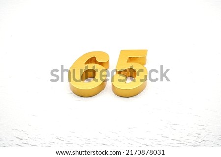  Number 65 is made of gold-plated teak, 1 cm thick, laid on a white painted aerated brick floor, giving good 3D visibility.                              