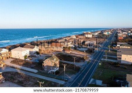 Aerial View of homes and the beach during golden hour in Nags Head North Carolina Royalty-Free Stock Photo #2170879959
