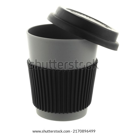 bamboo glass for tea or coffee drinks with silicone lid on white background