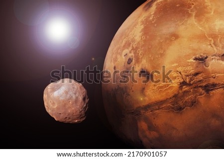 Mars planet with satellite. Elements of this image furnished by NASA. High quality photo Royalty-Free Stock Photo #2170901057