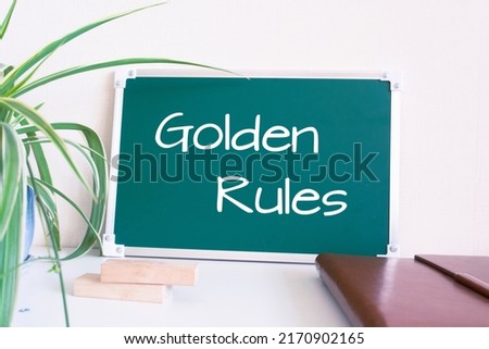 Text Golden Rules written on the green chalkboard