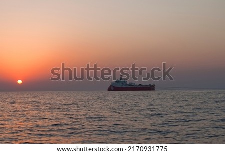 Sunset and vessel view on sea Royalty-Free Stock Photo #2170931775