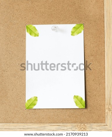 blank paper and leaf on wooden bords-images