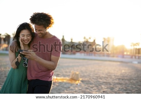 Beautiful young couple enjoy at the beach. Happy couple having fun at sea resort	