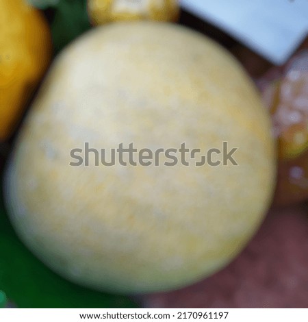 Defocused medium-sized round melon in Indonesia