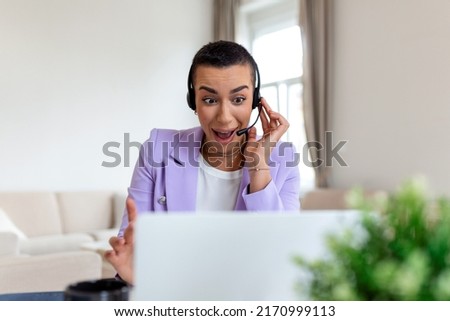 Young friendly operator woman agent with headsets. Beautiful business woman wearing microphone headset working in the office as a telemarketing customer service agent, call center job concept.