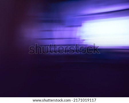 Blurry silhouettes of  movie and video production in studio interior. Lights blurred bokeh making movie and TV in studio. 
