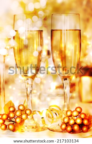 Glasses of golden white wine in celebratory atmosphere