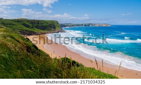 Beatiful ocean coast in summer day. Spain, suburb of Suances, summer day in the Province of Cantabria, it is photographed from Playa de Los Locos Royalty-Free Stock Photo #2171034325