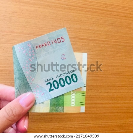 Twenty thousand rupiah worth of paper money (Rp. 20.000).  Royalty-Free Stock Photo #2171049509