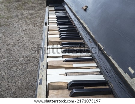 Keyboard of old shabby piano
