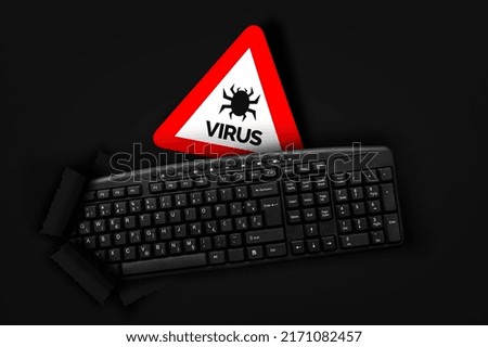 PC keyboard with Computer virus sign on black background