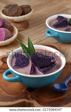Indonesian traditional soup kolak ubi ungu or sweet potato in coconut milk stock. In Indonesia, kolak is a popular iftar dish during the holy month of Ramadan and is also a popular street food