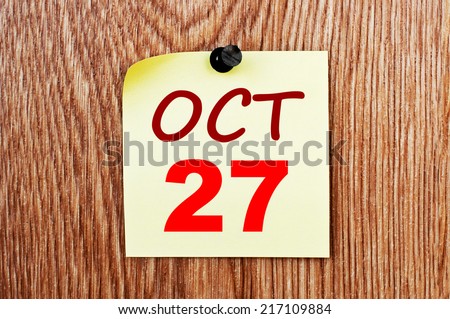 October 27 calendar. Note paper on a message board
