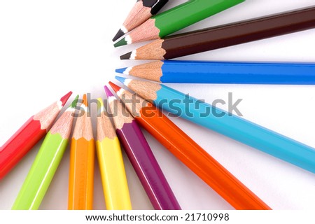 Color pencils styled in a half circle on white background