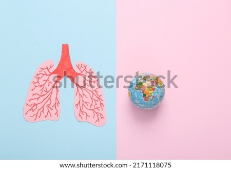World Lung Day. Paper cut lungs with globe on blue pink pastel background