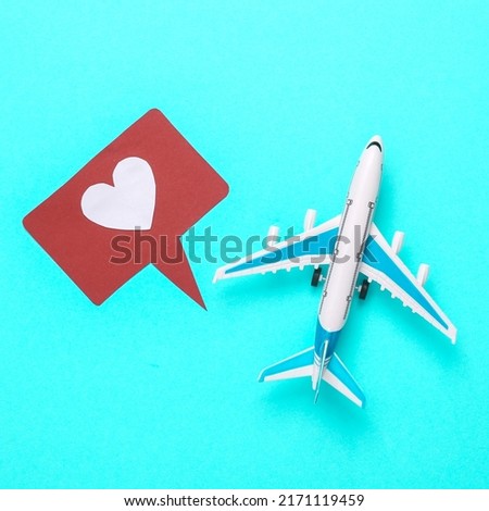 Air plane and like notification icons on blue background. Travel concept. Rating, followers feedback. Top view