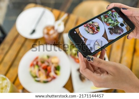 Take photo of the food in outdoor cafe