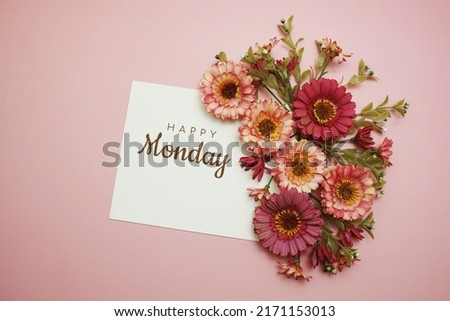 Happy Monday typography text with flowers on pink background